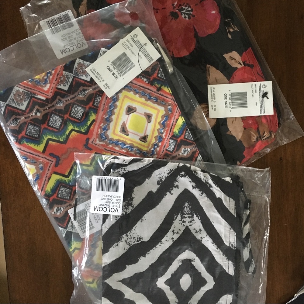 Three Volcom pouches