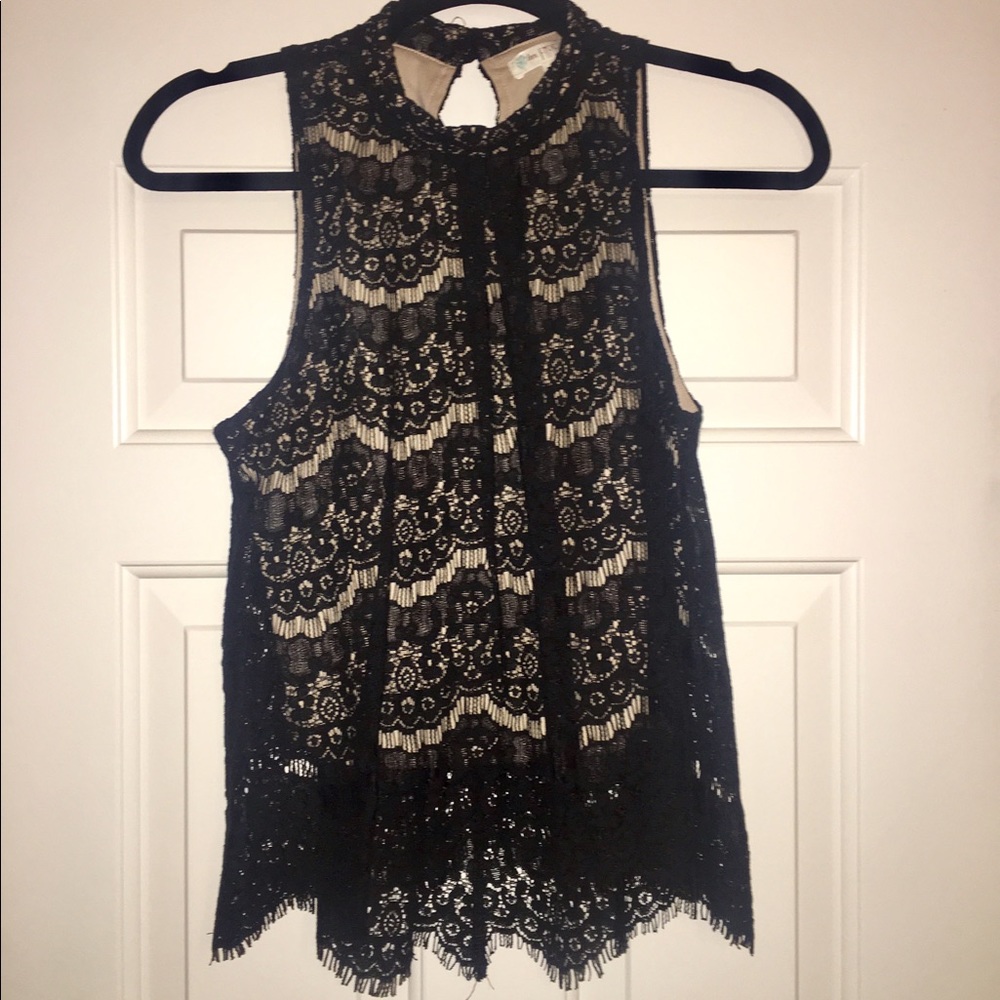High neck, sleeveless shirt