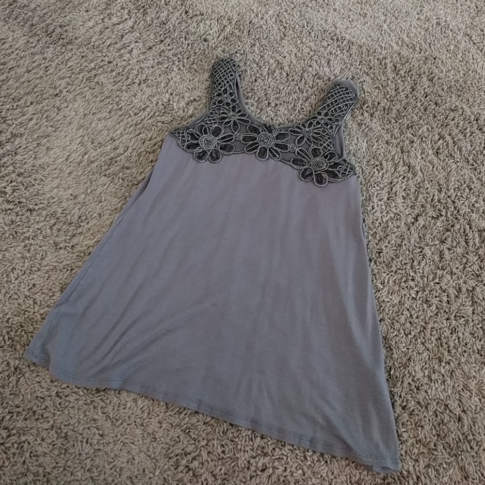 Sleeveless top with floral embellishment