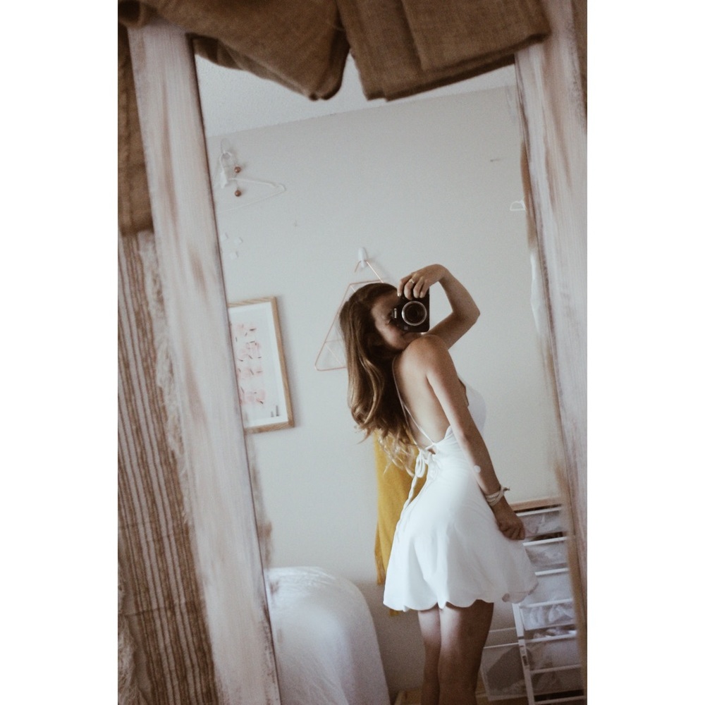 Scalloped, backless little white summer dress