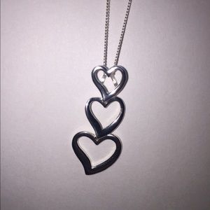 Necklace with 3 silver hearts on a silver chain