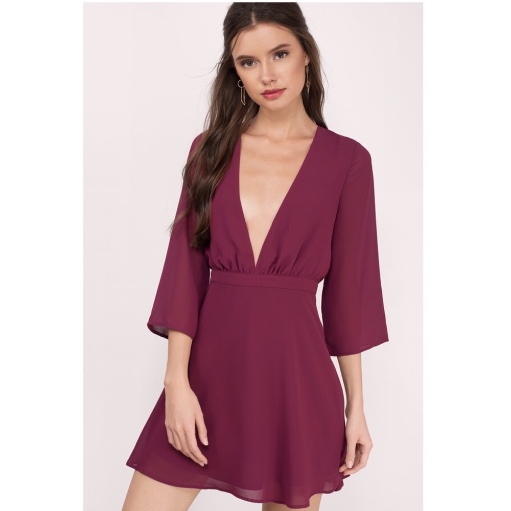 Long sleeve low cut dress.