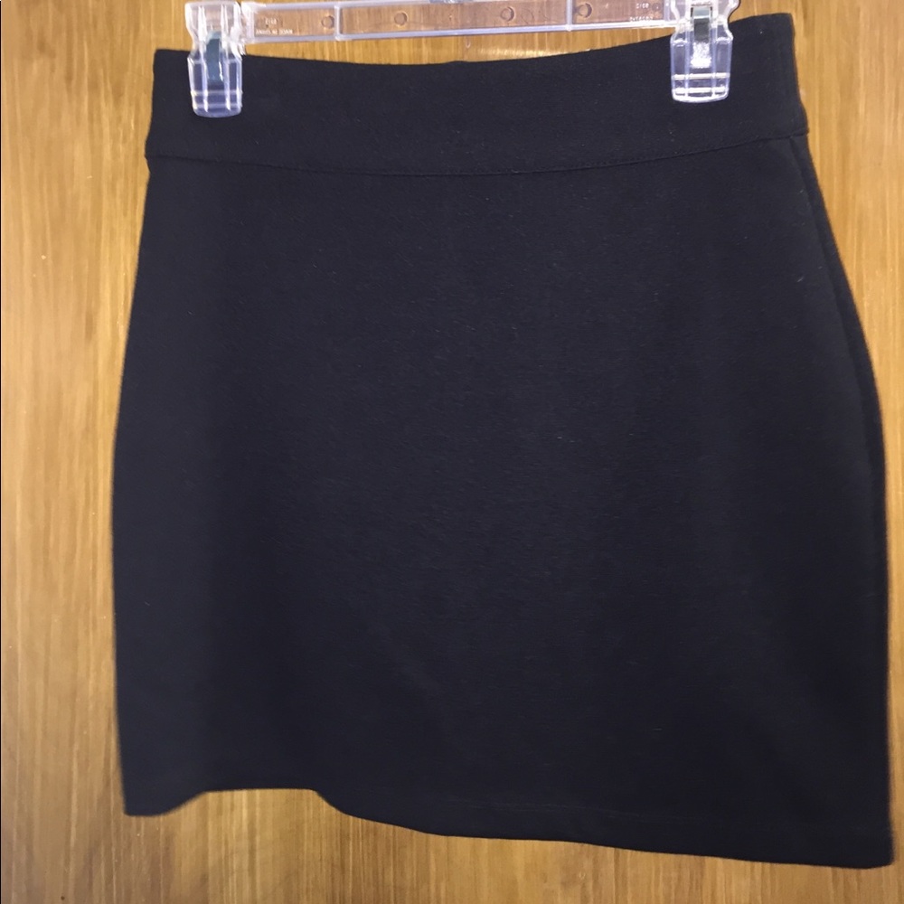 Stretchy black skirt with gold zipper in back