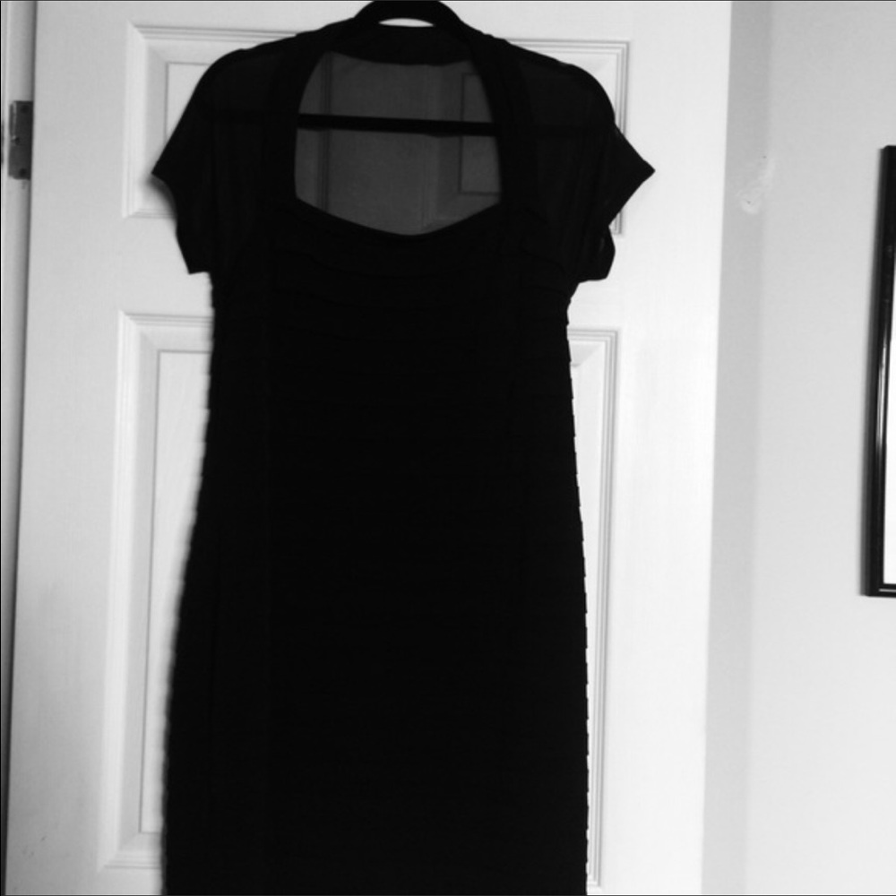 Little black dress with sheer cap sleeve.