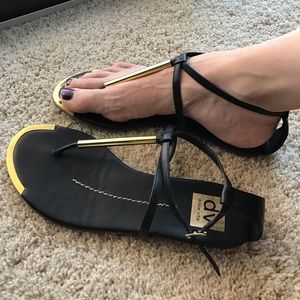 Black strappy sandals.