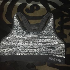 Medium Nike gray, black, & white sports bra