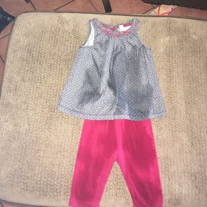 A matching set of red leggings and a cute shirt