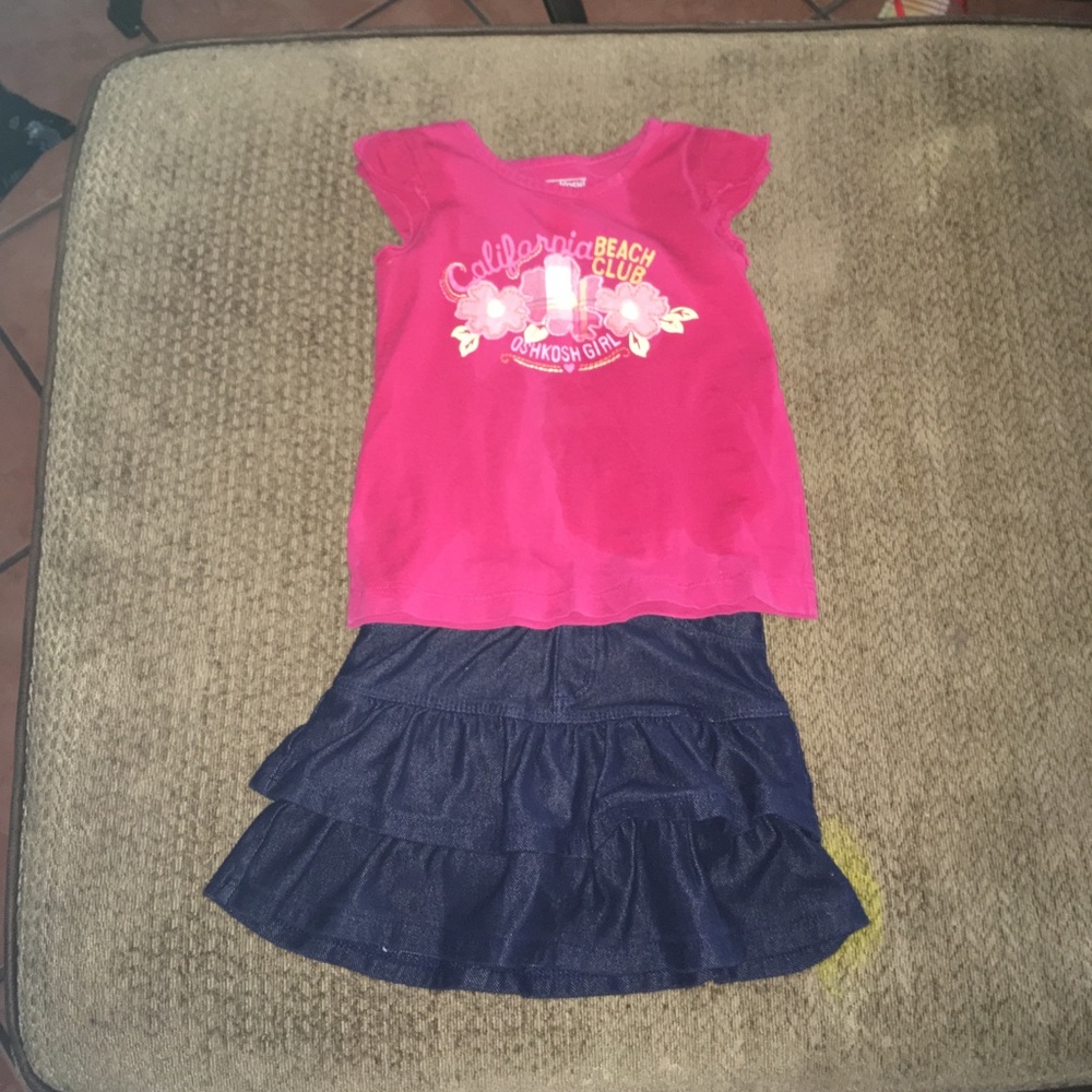 A set of a pink shirt and navy blue skirt