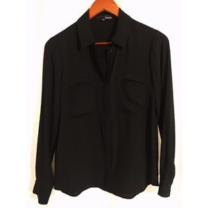 Black long sleeved button-down collared shirt.