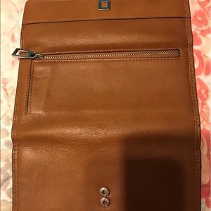 Excellent shape , only used one week lotus wallet