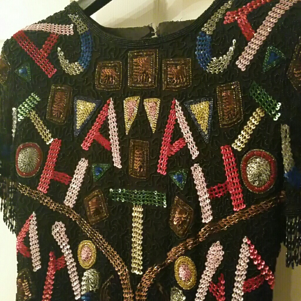 Dress sequined with beads..lined...14" w by 37" h