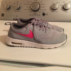 Gray and pink Nike running shoes