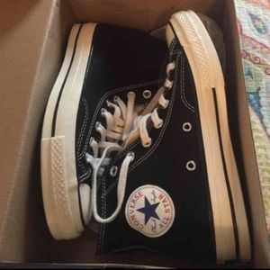 Black high top converse sneakers