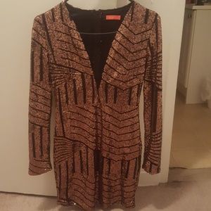 A black and gold sequin  dress