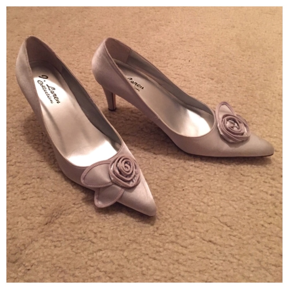 Silver "Cindy" pointy heels with a rosette accent