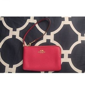 Coach hot pink with gold zipper wristlet