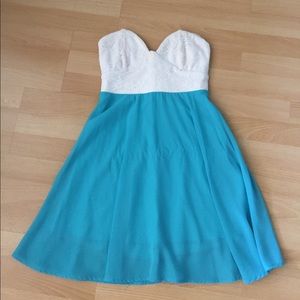 Strapless white and turquoise mini dress.