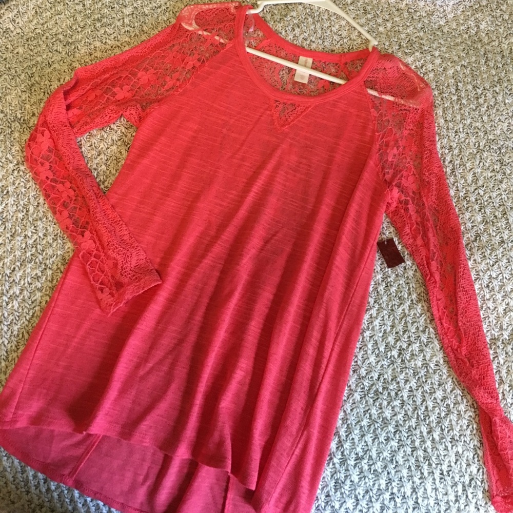 Peach long sleeve top.