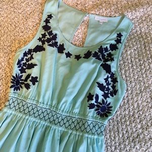 Light blue with navy blue design. Dress