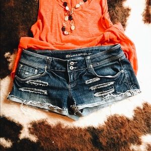 Distressed denim cutoff shorts