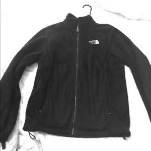 Black furry north face jacket