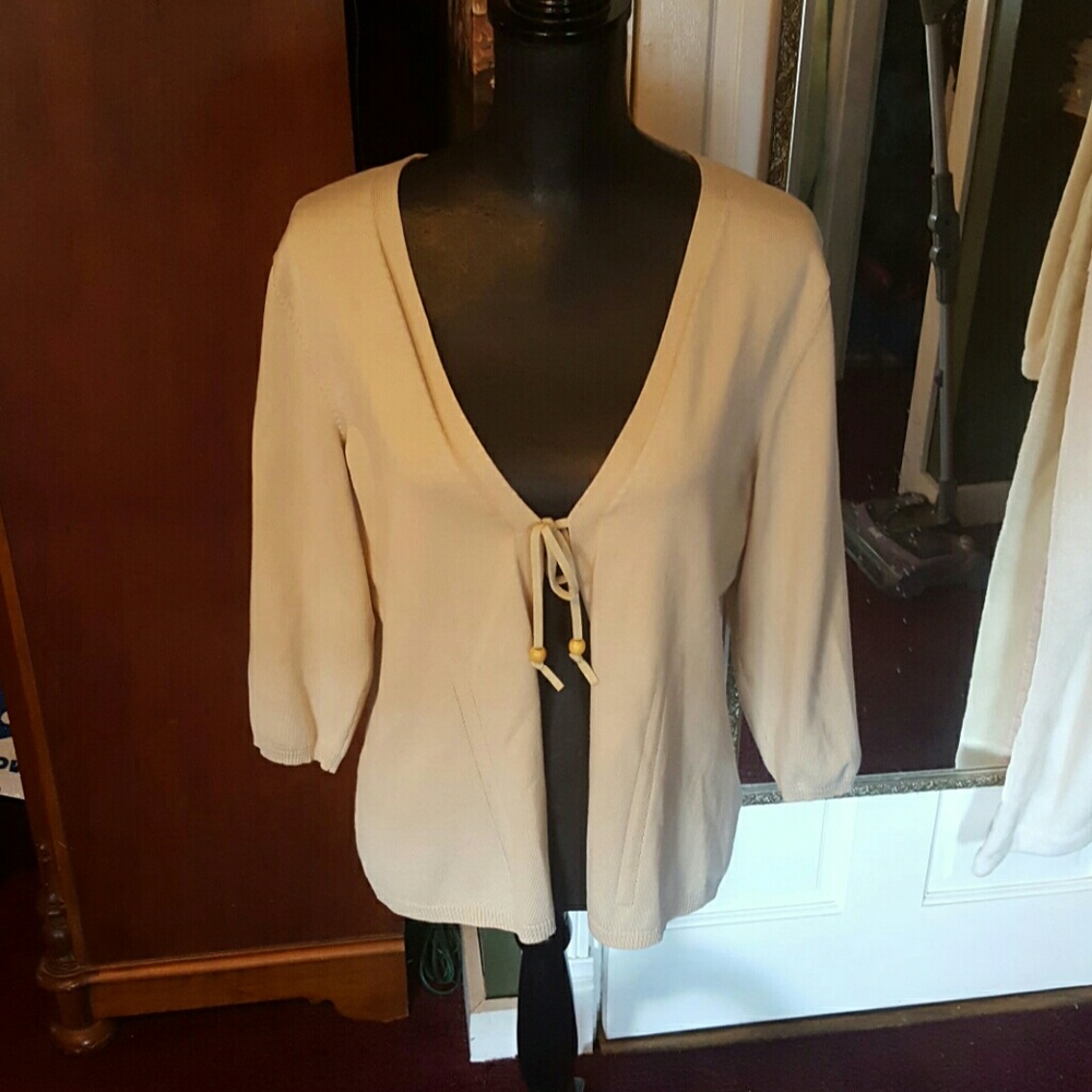 Josephine Claus tan sweater