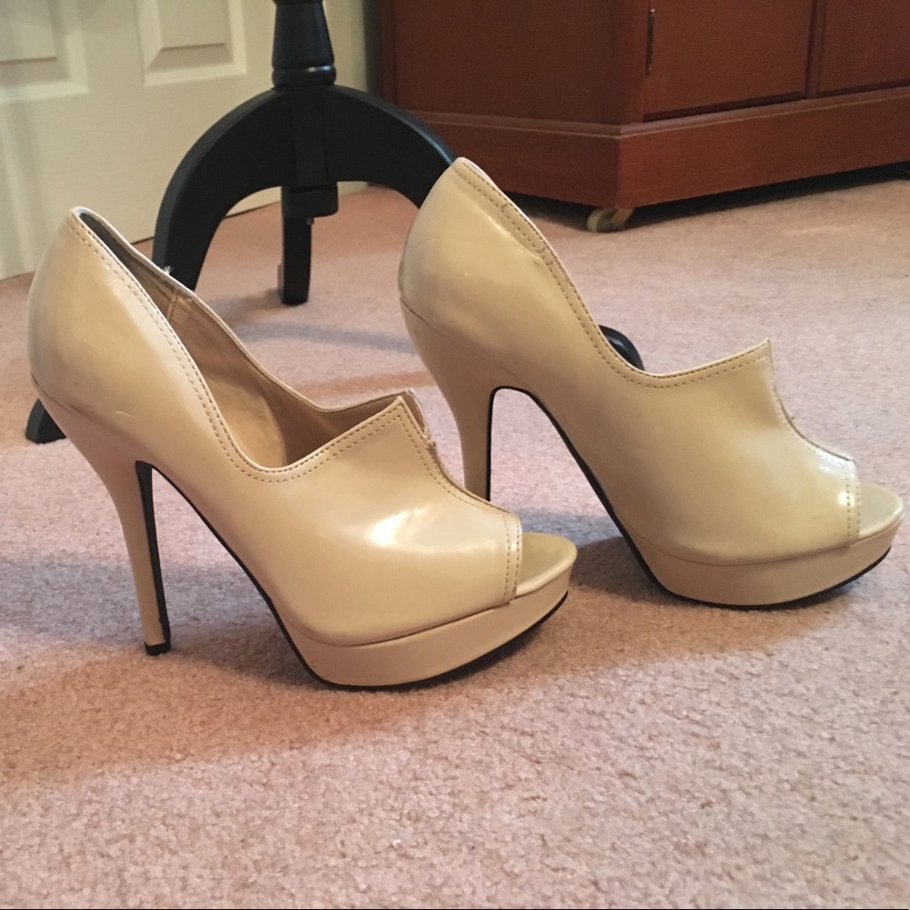 Faux patent leather bone color heels.