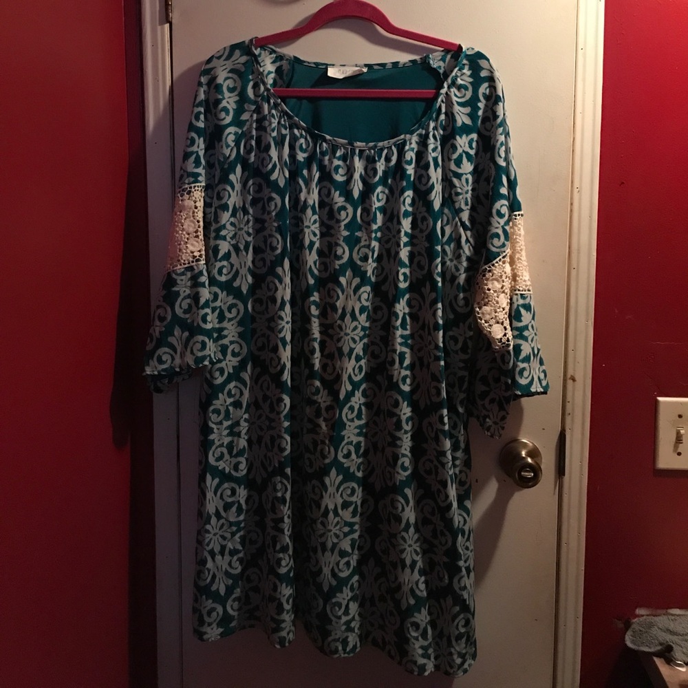 Green patterned dresses with lace cutouts on arms