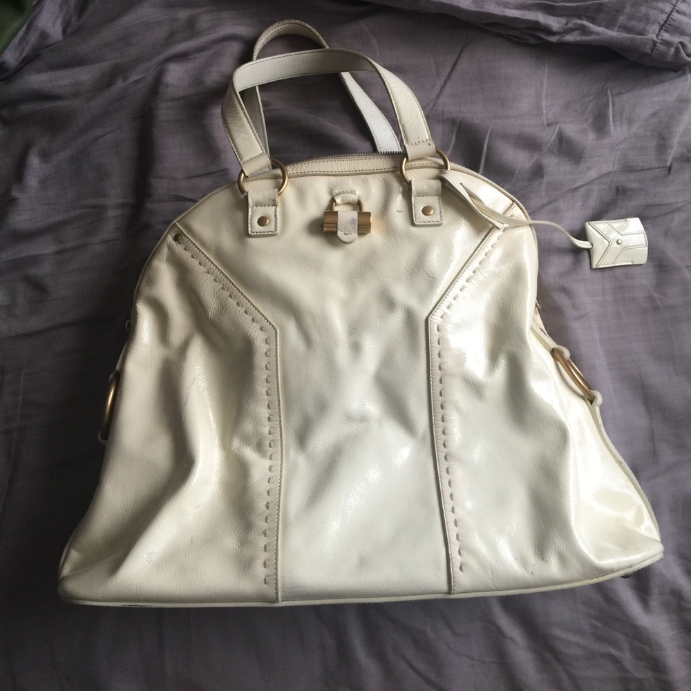Large cream YSL tote bag.