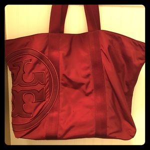 Wine colored Tory burch bag
