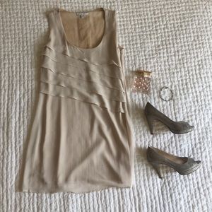 Light blush dress with ruffle detail