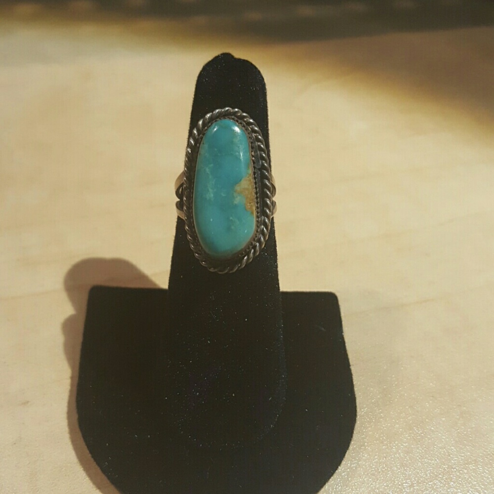 Large turquoise gemstone ring.