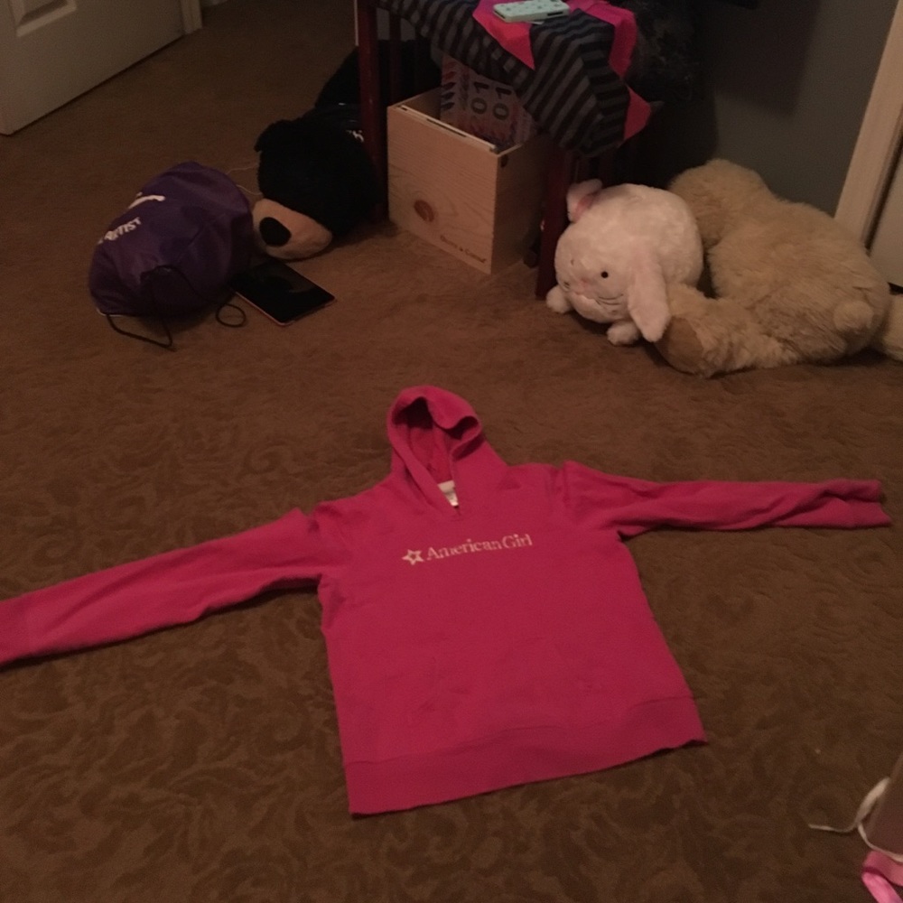A pink American Girl sweatshirt