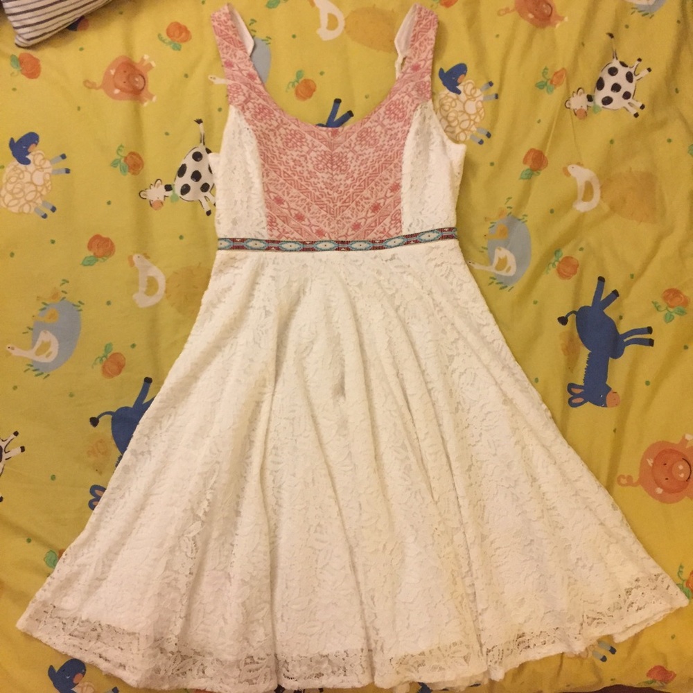 White dress with red patterns