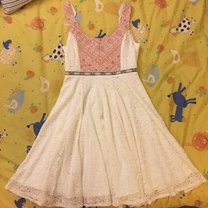 White dress with red patterns