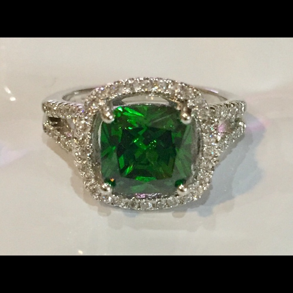 Sold !!! Green Zircon with 72 white Zircon stones.
