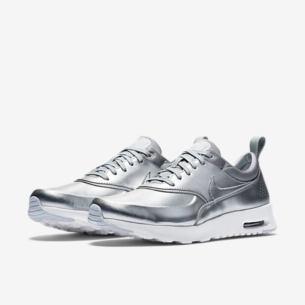 Nike silver metallic Thea size 10.