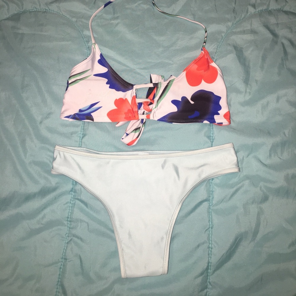 Floral bathing suit top, light blue bikini bottom