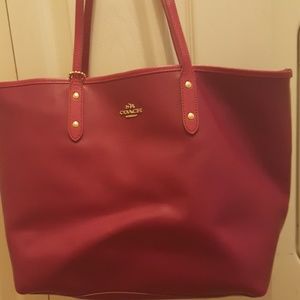 Fushia colored coach purse