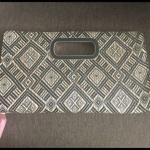 Cute and trendy express clutch.  Never used !