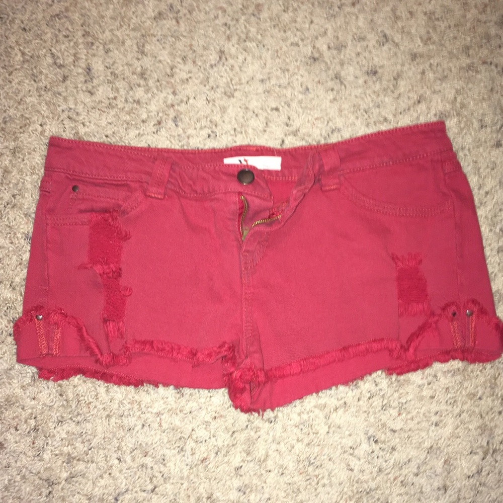Red distressed jean shorts