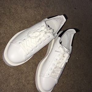 White tennis shoes by Steve Madden.