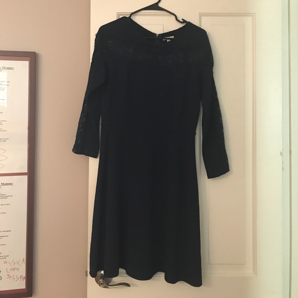 An adorable navy long sleeved party dress.