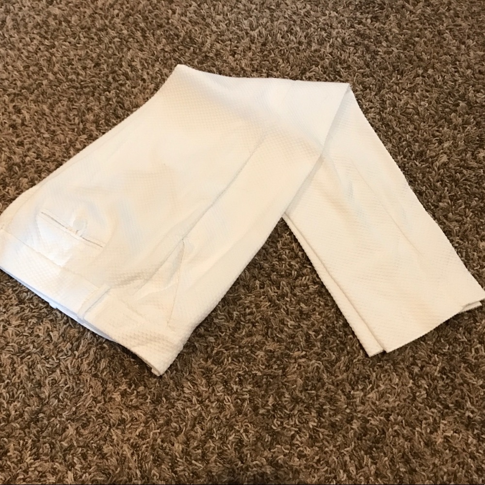 White, textured crop pants.