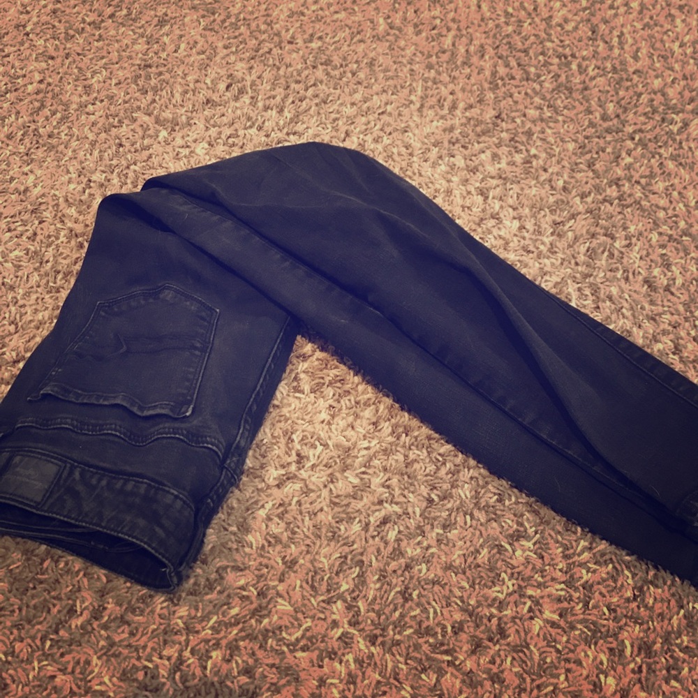 Worn, black jeans.