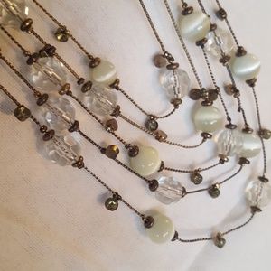 Vintage look multi-strand beaded necklace.