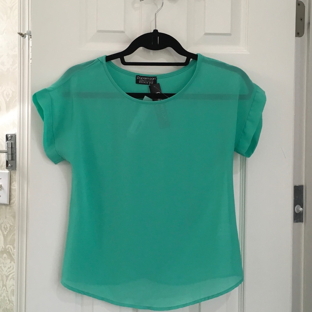 Light green blouse with crossover detail to back