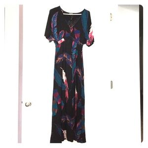 Beautiful maxi V neck dress with an open side!