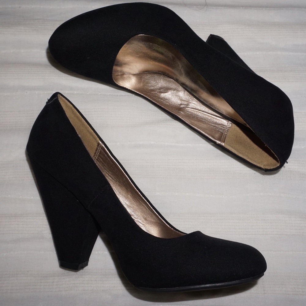 Used black suede heels. Size 7.