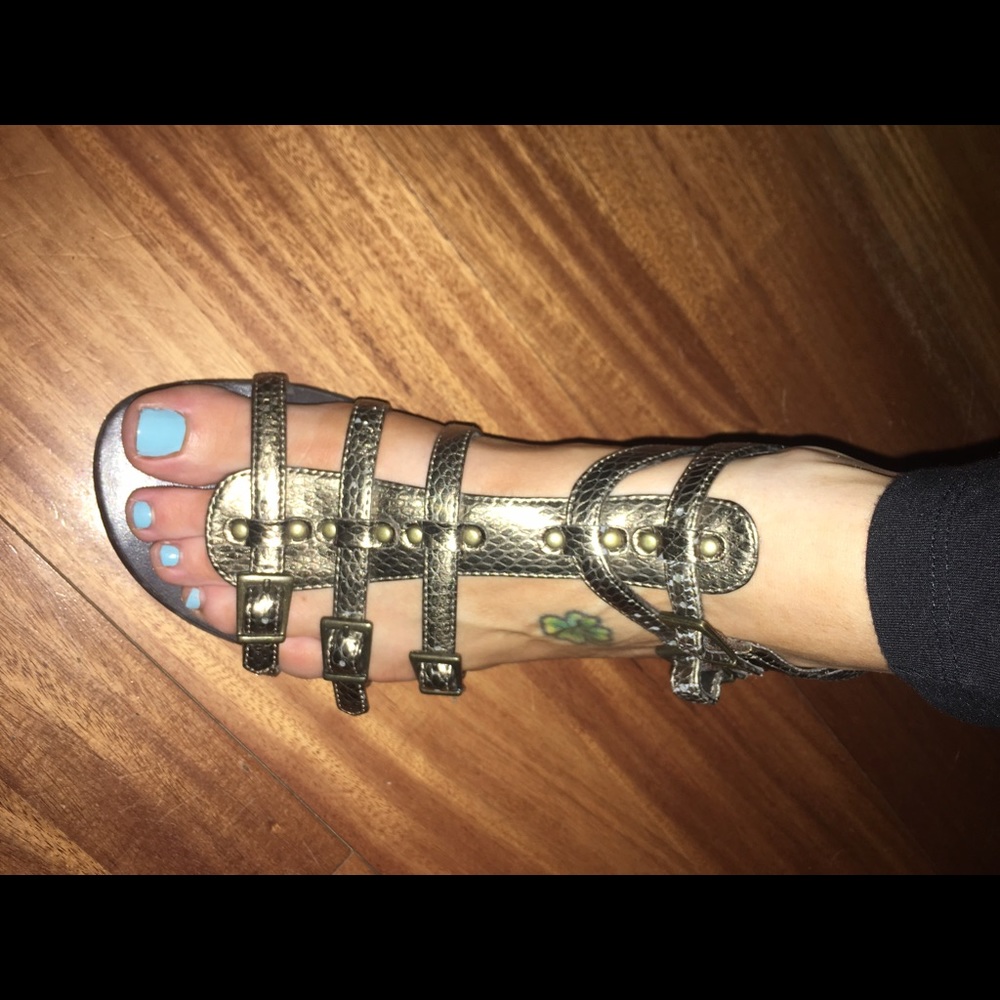 Coppery gladiator sandals size 6.5 but run big